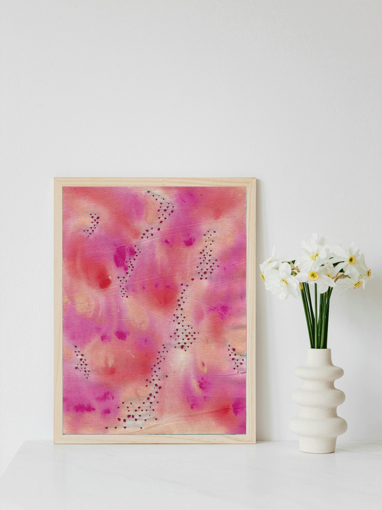 Abstract art piece with a pattern of repetitive brushstrokes in various shades of pink, enhanced by intricate embroidery. The combination of painted and embroidered elements creates a visually dynamic and textured composition.