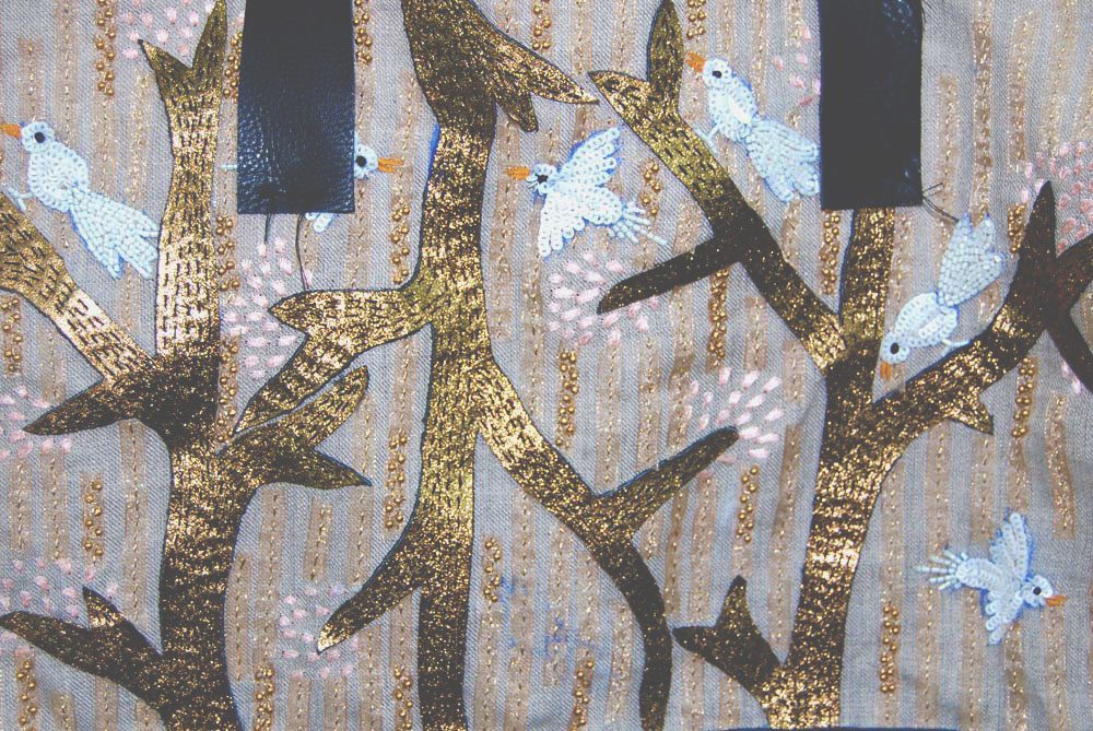 Tambour embroidery detail, artisan workshop India, design of birds and trees with beading