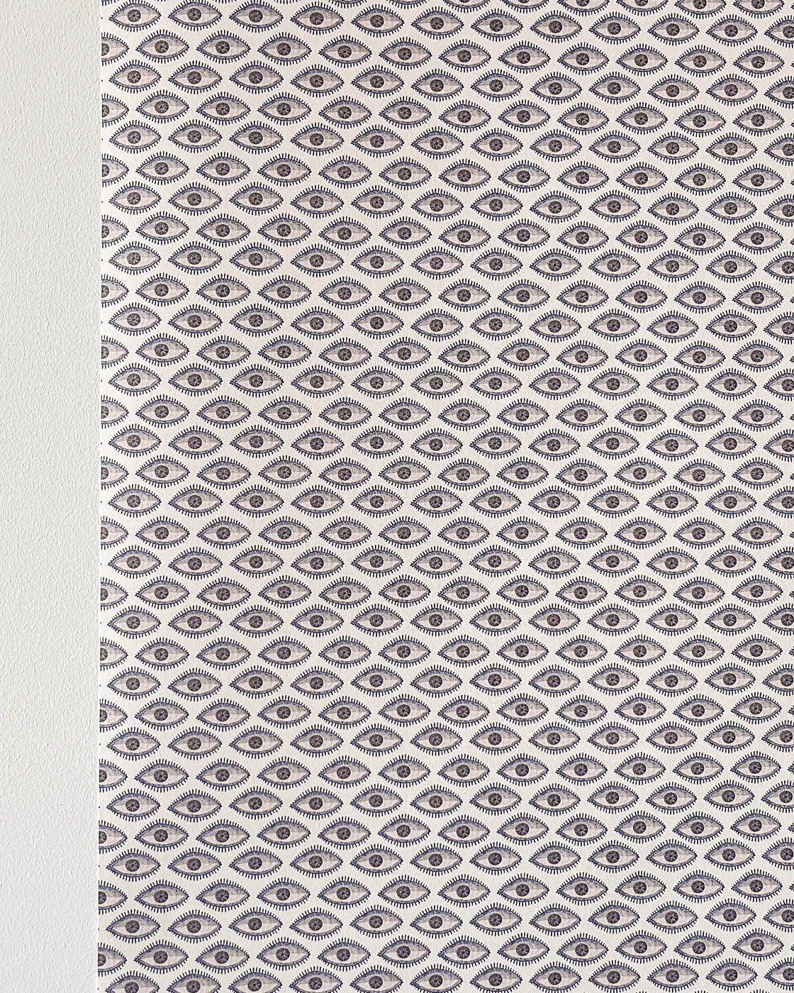 Evil eye wallpaper on wall in blue beige